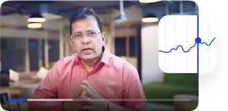 Trading tutorial video in the app with an instructor speaking next to a stock market chart icon.
